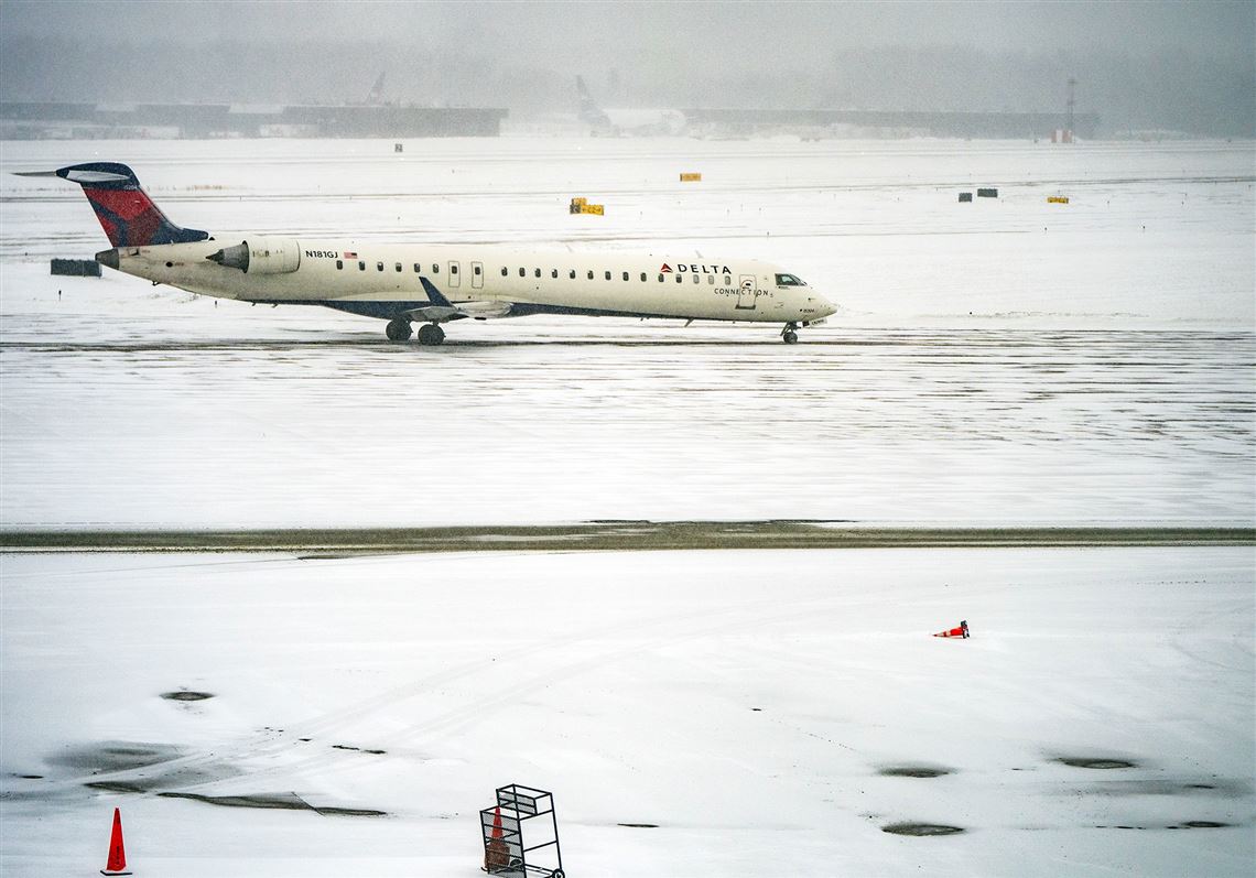 At least 8 reported injured after Delta jet flips during landing at ...