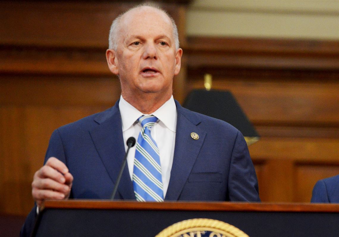 David Hickton, then U.S. Attorney for the Western District of Pennsylvania, in a 2016 file photo. Mr. Hickton will lead a task force examining potential bias in algorithms. Behind him is Mark Nordenberg, chancellor emeritus of the University of Pittsburgh. (Pam Panchak/Post-Gazette)