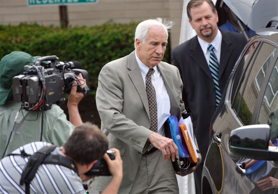 Jerry Sandusky leaves the Centre County Courthouse following the first day of testimony in his trial in 2012.