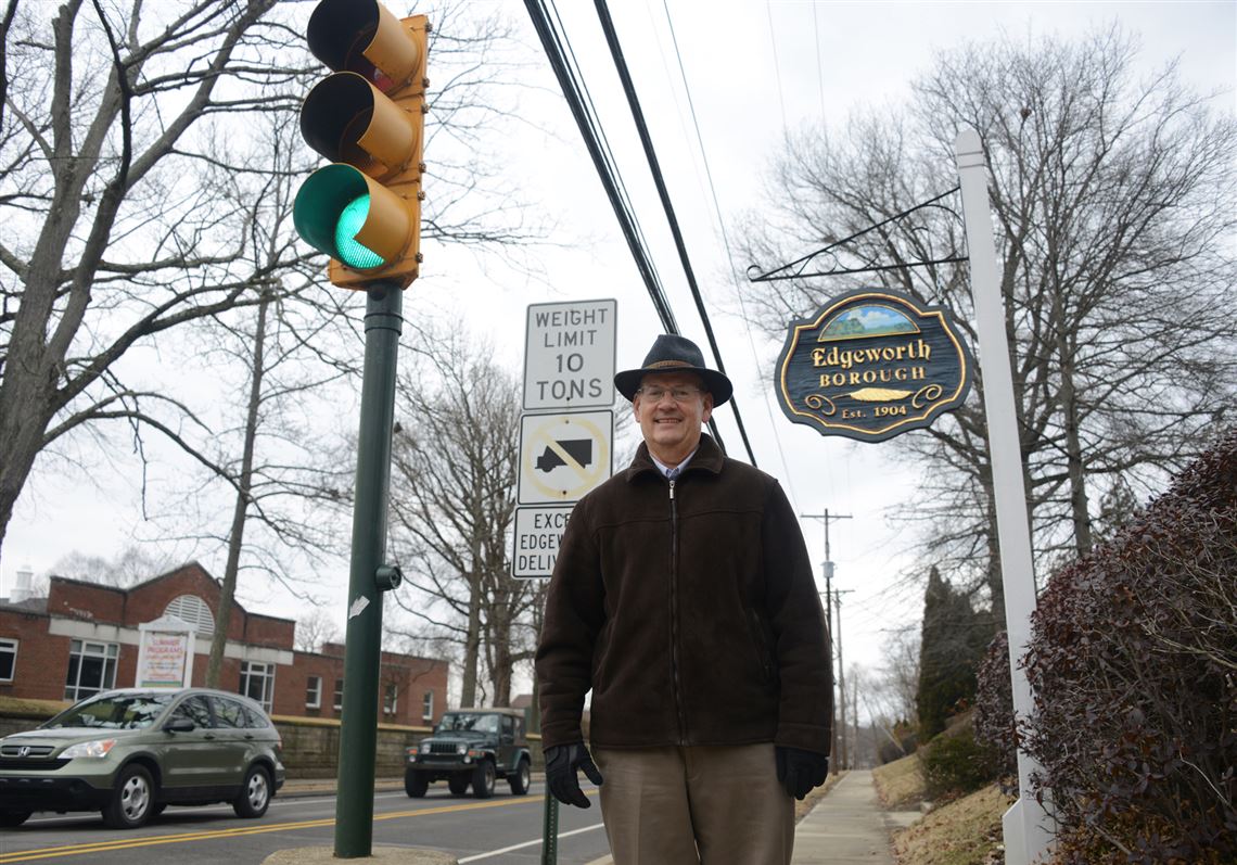 In this file photo taken March 20, 2014, Edgeworth Borough Manager Marty McDaniel stands at the corner of Beaver Street and Academy Avenue. The borough switched its stop lights to LEDs.