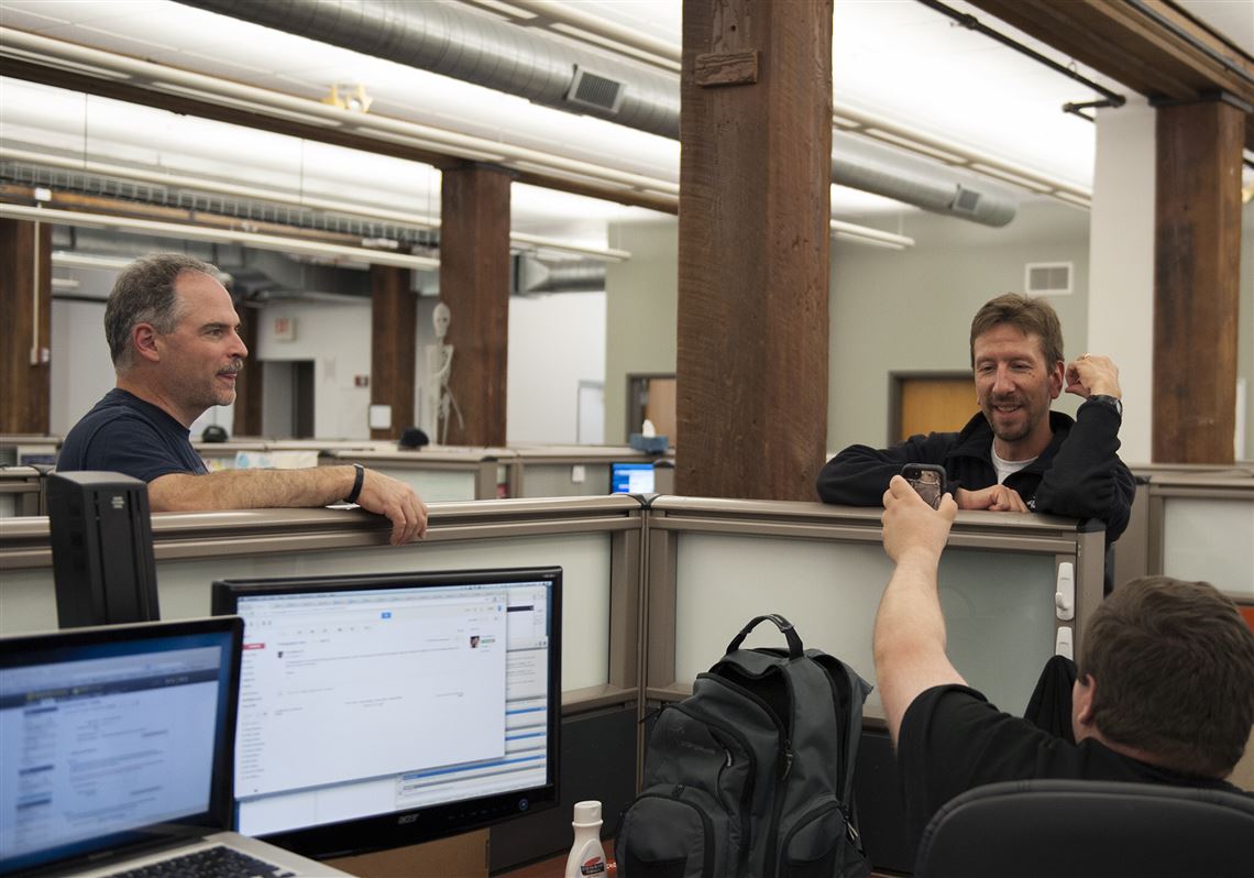 In this 2014 photos, employees of Avere Systems, Inc., a data storage company, talk in their office. 