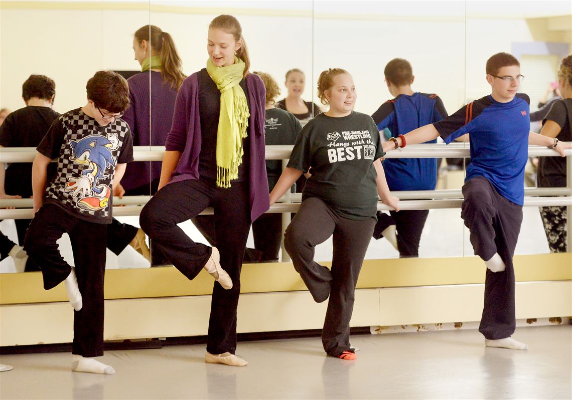 Working with Alyssa Herzog Melby, director of education at the Pittsburgh Ballet, are, from left, Jacob Schmitt, Lauren Sodersten and Colton Vazquez. They were in a dance class at the ballet's headquarters in the Strip District.