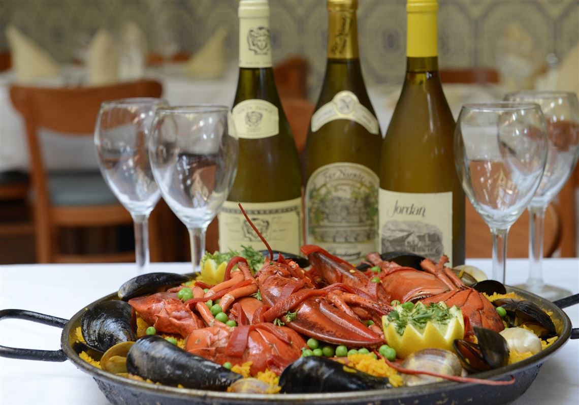  Paella with lobster, mussels, clams, scallops, shrimp, chicken, Spanish sausage and rice with saffron at Mallorca.