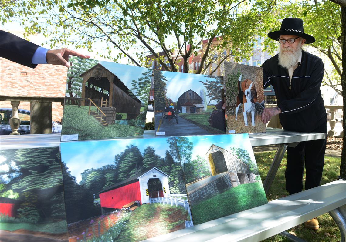 Lewis Jim Fogle displays his art.