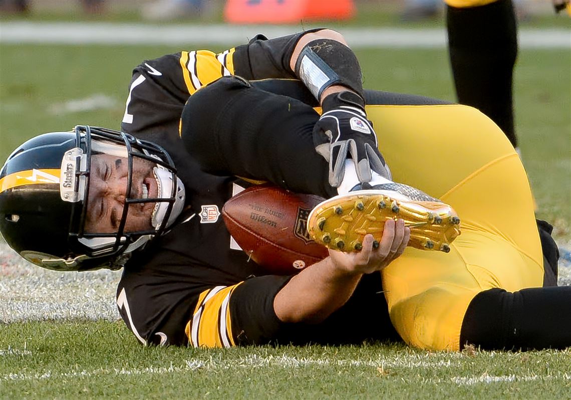 Ben Roethlisberger of the Pittsburgh Steelers is sacked by Michael