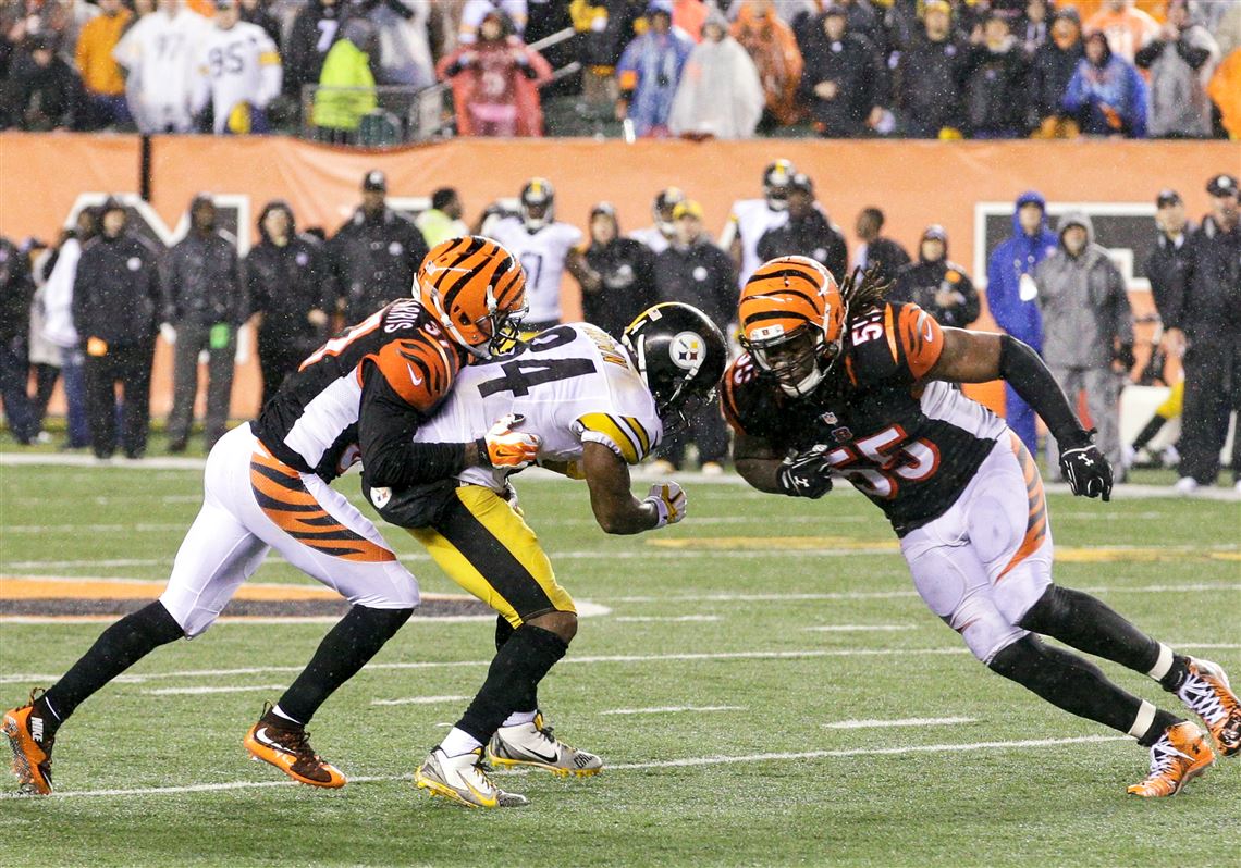 Cincinnati Bengals' Vontaze Burfict, right, runs into Pittsburgh Steelers' Antonio Brown during the teams' NFL wild-card playoff game in January.