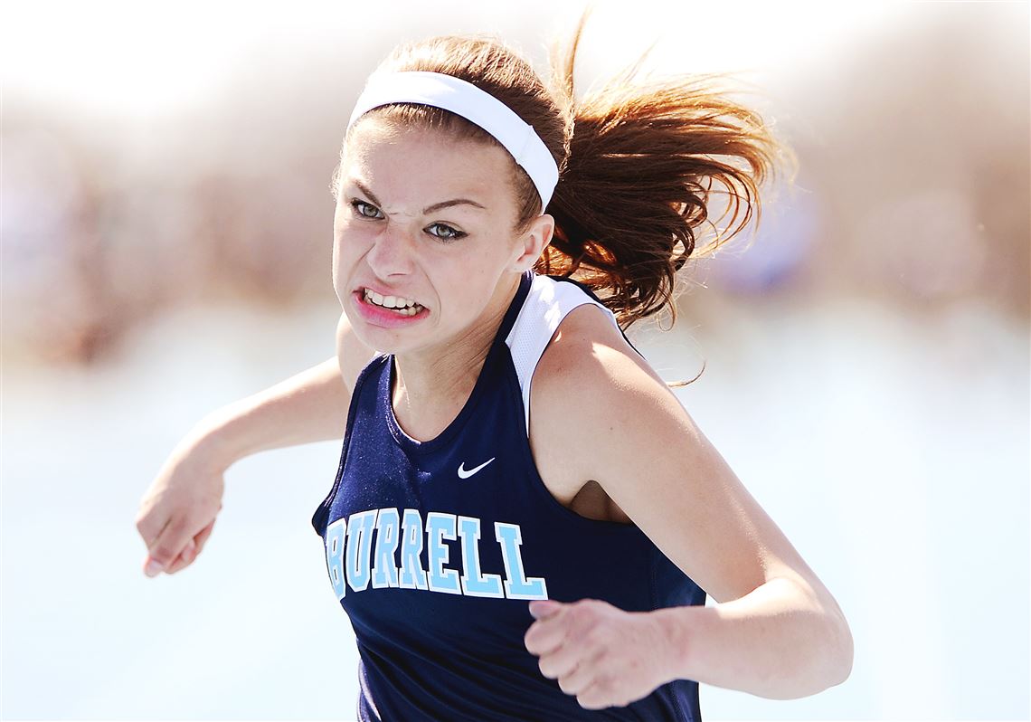 Burrell's Nikki Scherer leans into the finish line during the 100-meter dash finals at the Tri-State Coaches Association Invitational Saturday at West Mifflin High School.