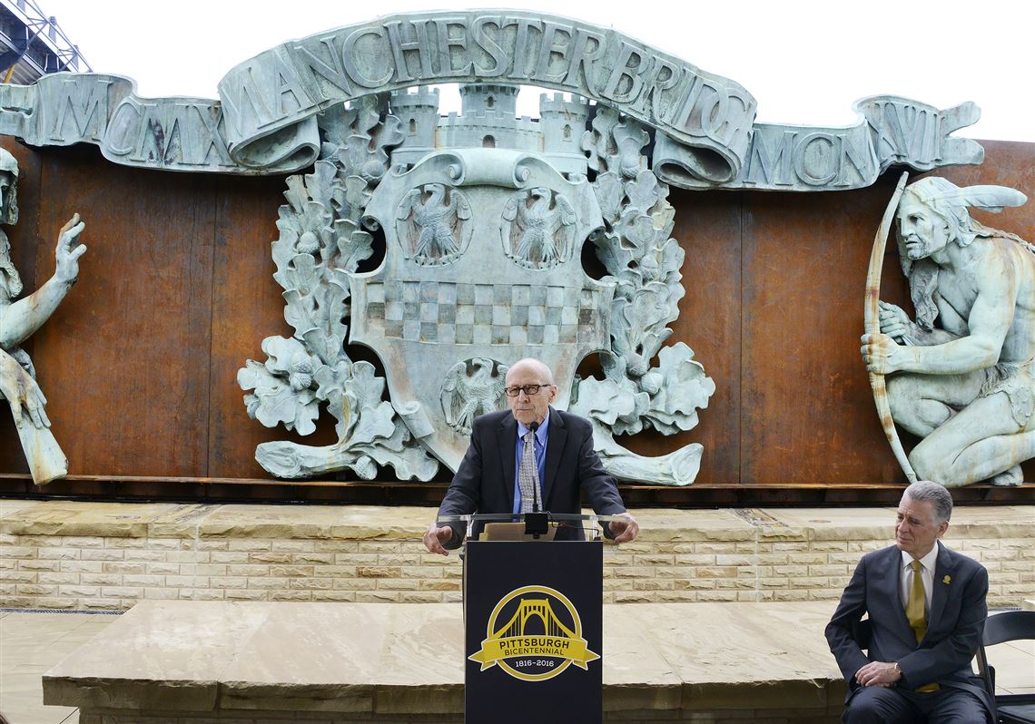 Pittsburgh History & Landmarks Foundation president Arthur Ziegler speaks Thursday on the North Shore while Manchester Bridge portal scuptures are unveiled.