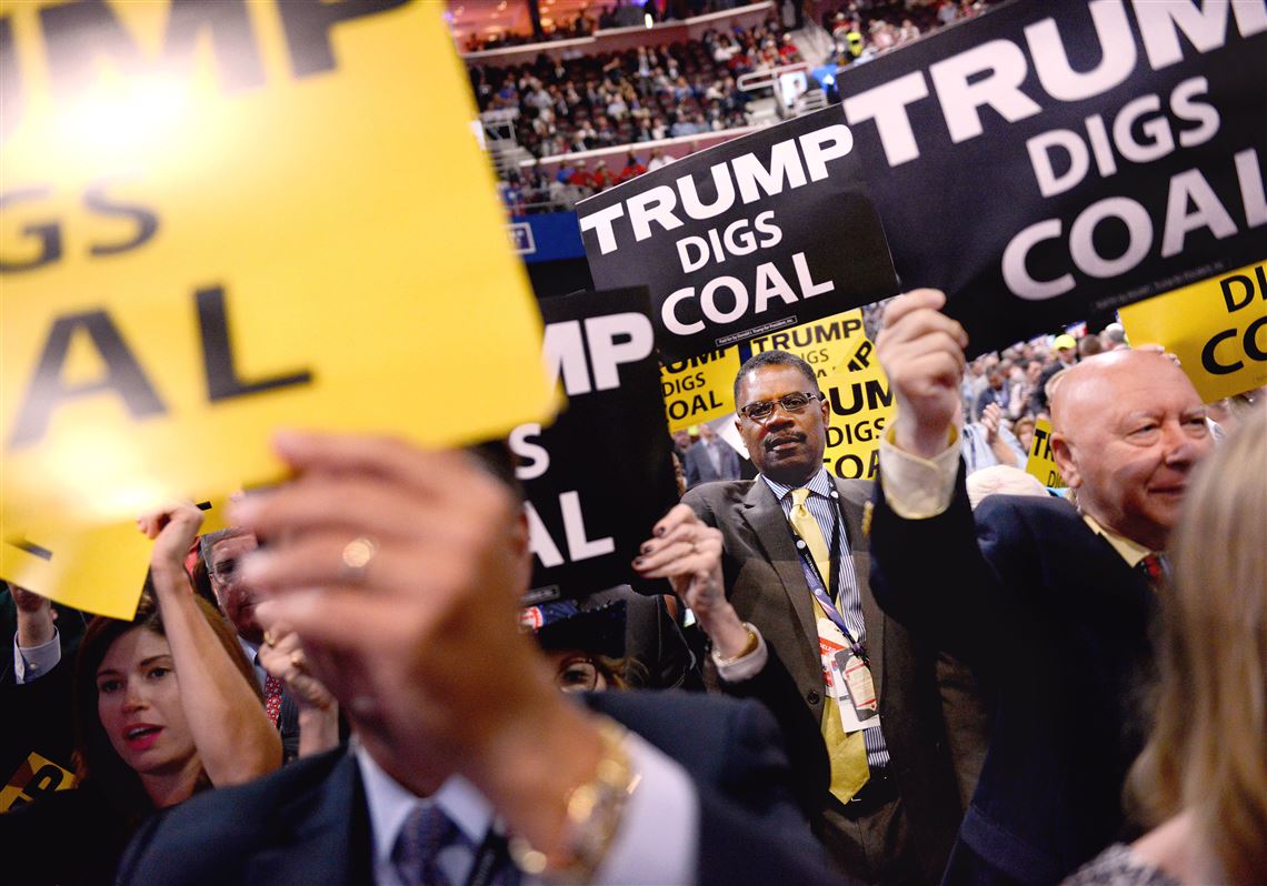 Members of the Pennsylvania Delegation hold up signs that read 