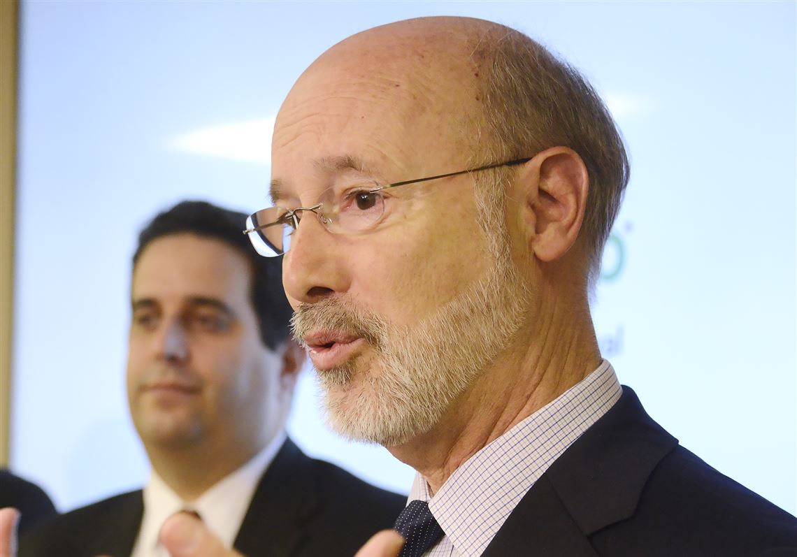Gov. Tom Wolf and, in background, Ted Dallas, secretary of the Department of Human Services in Pennsylvania