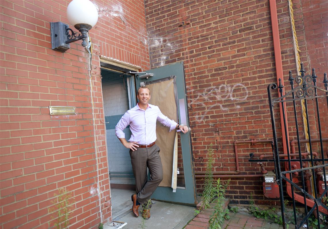 James Haluszczak, founder and managing partner of SteelBridge Labs, opens the front door of what will be the company’s new location on Smallman Street in the Strip Disrict.