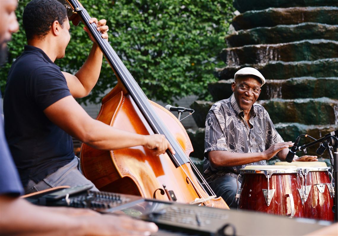 The George Jones New View Trio performs at Katz Plaza Downtown on Tuesday, August 23, 2016. Mr. Jones is at right on conga drums.