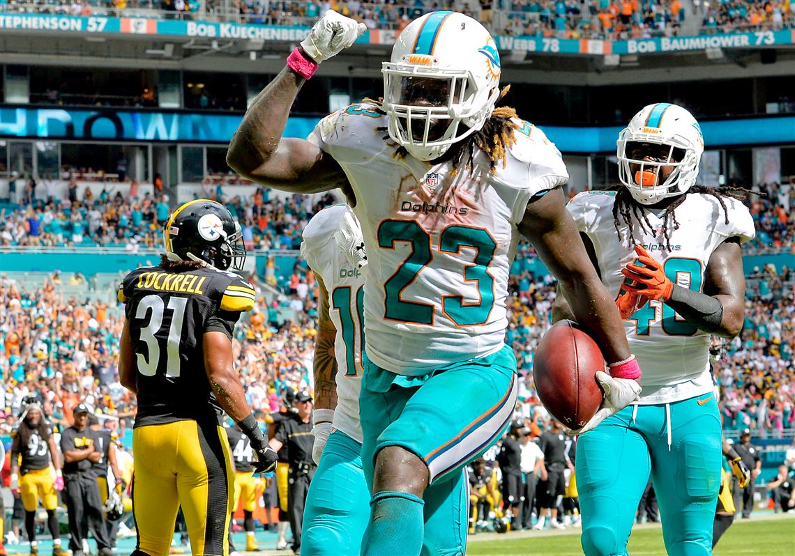 Miami Dolphins running back Jay Ajayi, left, and quarterback Jay