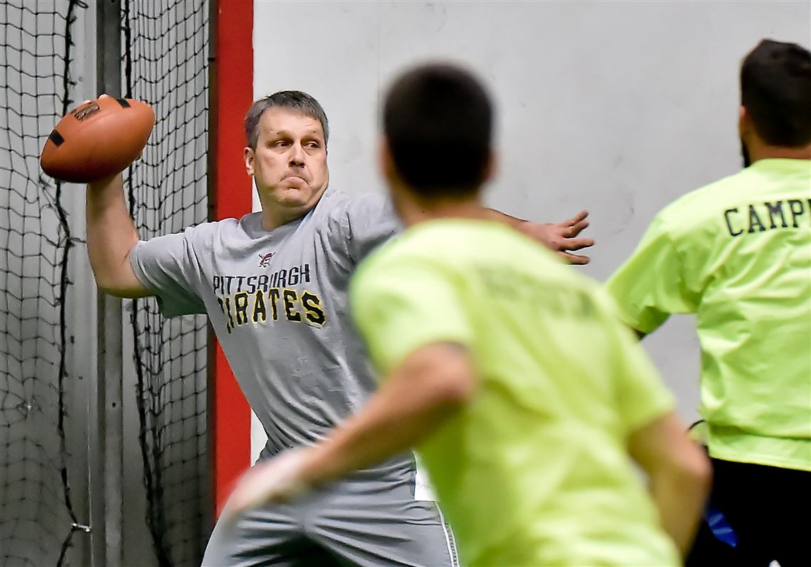 Rob Roberts, 46, drops back to pass during his team's flag football game at Pittsburgh Indoor Sports Arena in Cheswick Jan. 27, 2017. 