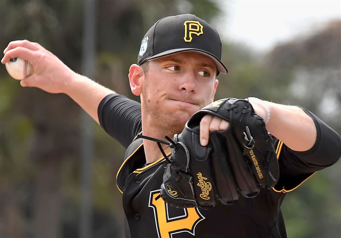 Chad Kuhl delivers during live batting practice February 21 at Pirate City.