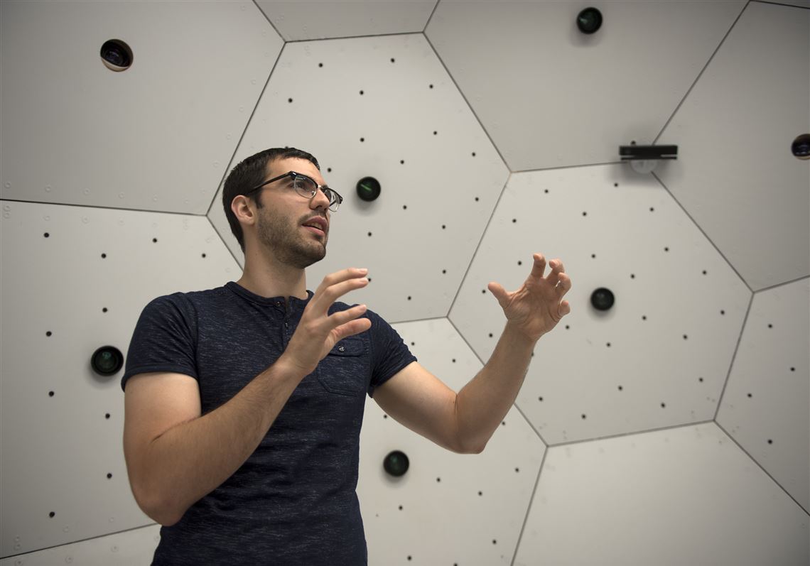 Ginés Martinez, a part time CMU student in robotics, explains Tuesday how the OpenPose program works inside the Panoptic Studio at Carnegie Mellon University in Oakland. 
