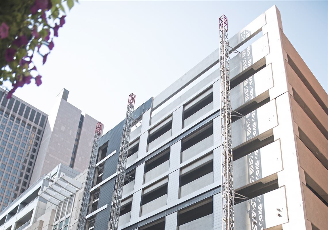 Developers adding more condos and two more floors at former Saks