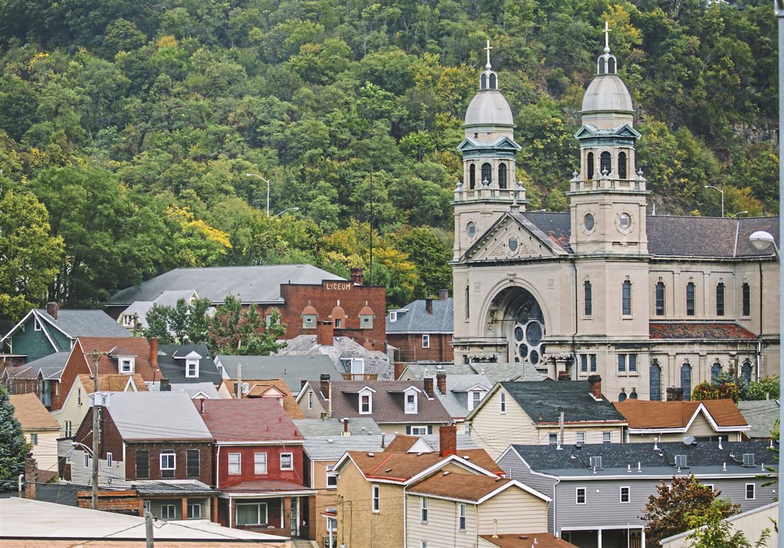 Gentrification is a concern among resiidents of Sharpsburg, Etna and Millvale. This file photo from Oct. 6, 2017, shows homes in Sharpsburg, with St. Mary Catholic Church in the background.