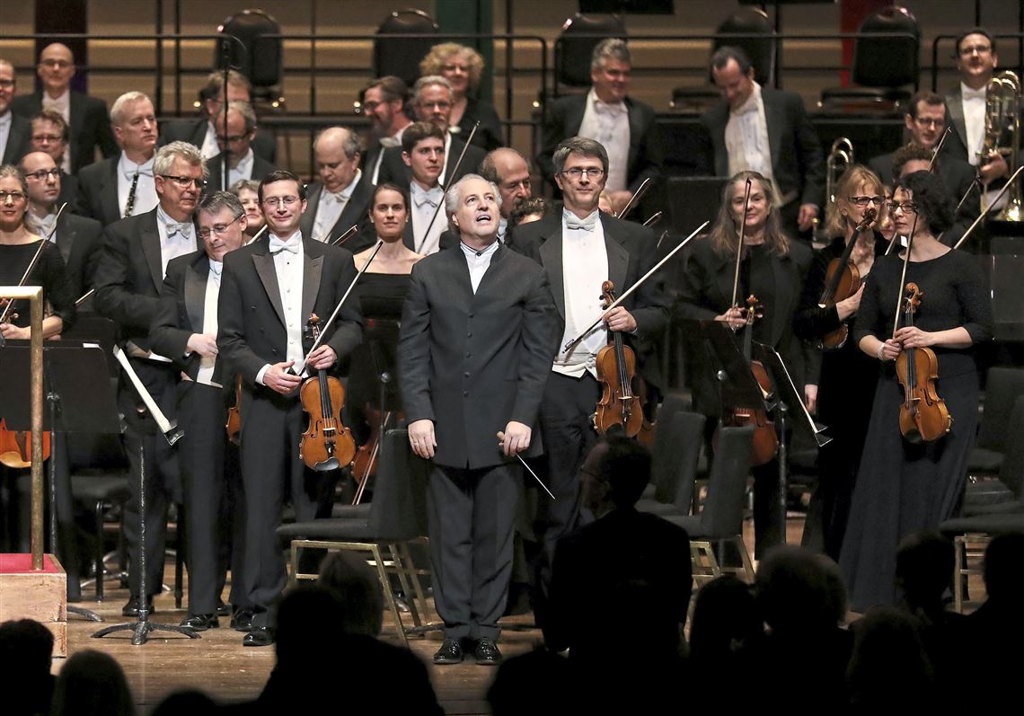 Manfred Honeck, Pittsburgh Symphony Orchestra conductor, and the PSO look out toward the audience as they receive a standing ovation after the first section of Beethoven Concerto Cycle: No. 2 at Heinz Hall in March 2018 in Downtown Pittsburgh. 