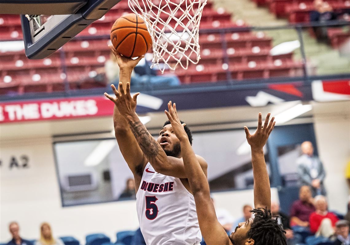 Marcus Weathers #5 of Duquesne goes up for a layup over a Maryland defender during the Duquesne basketball versus Maryland Eastern Shore, Thursday, Dec. 13, 2018, at A.J. Palumbo Center in Uptown. 