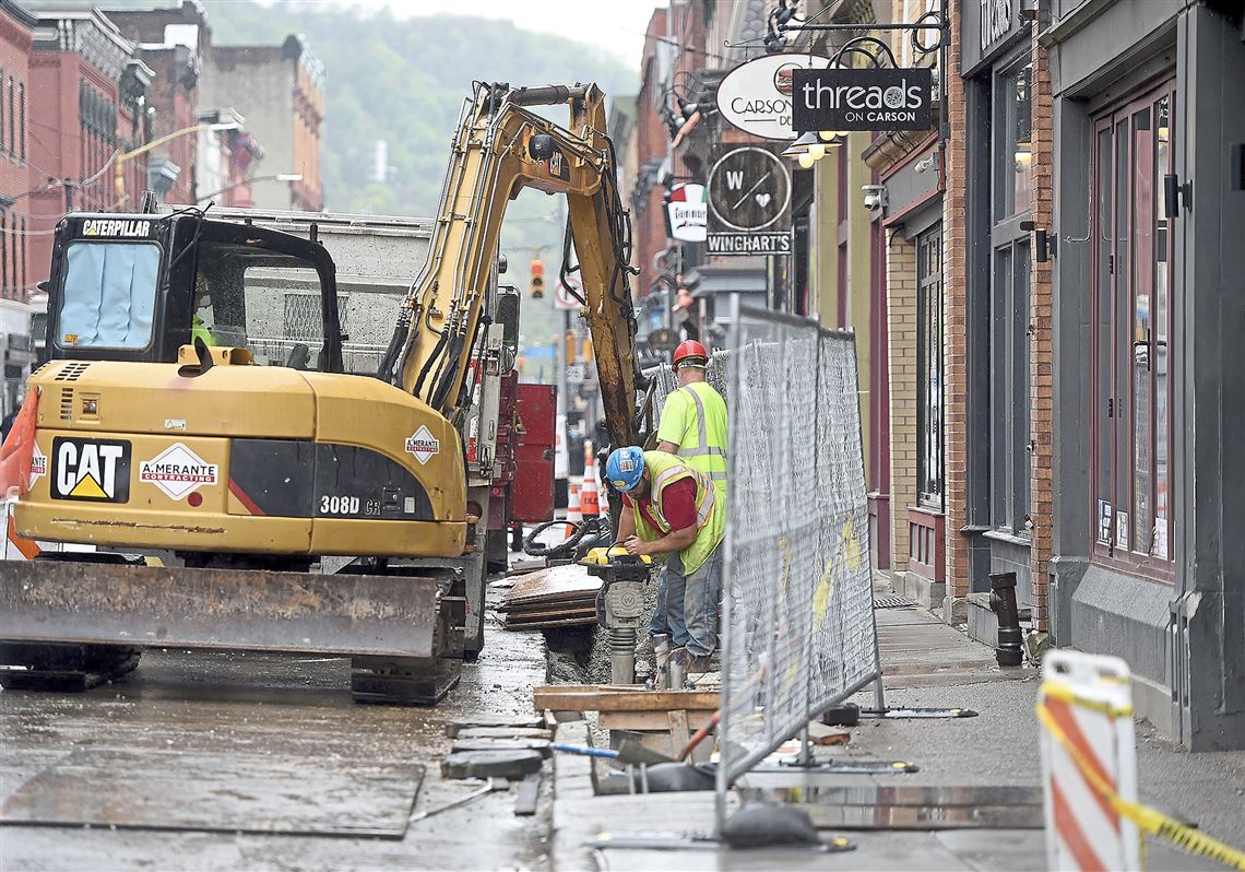 Stalled by vaults, South Side sidewalk project hurts stores