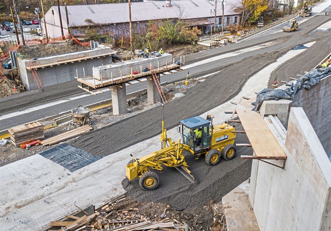 Work half done on installing unique Shaler Street brige
