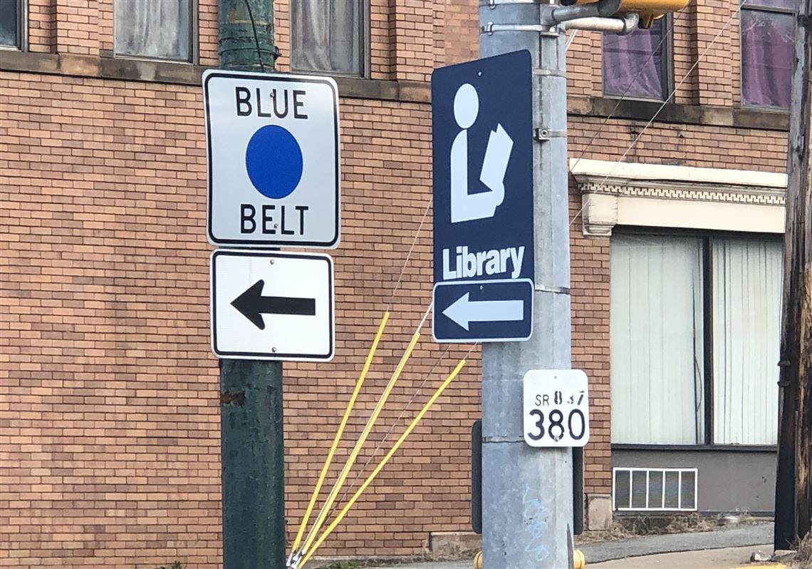 A Blue Belt sign on the corner of Eighth Avenue and West Street in Homestead.