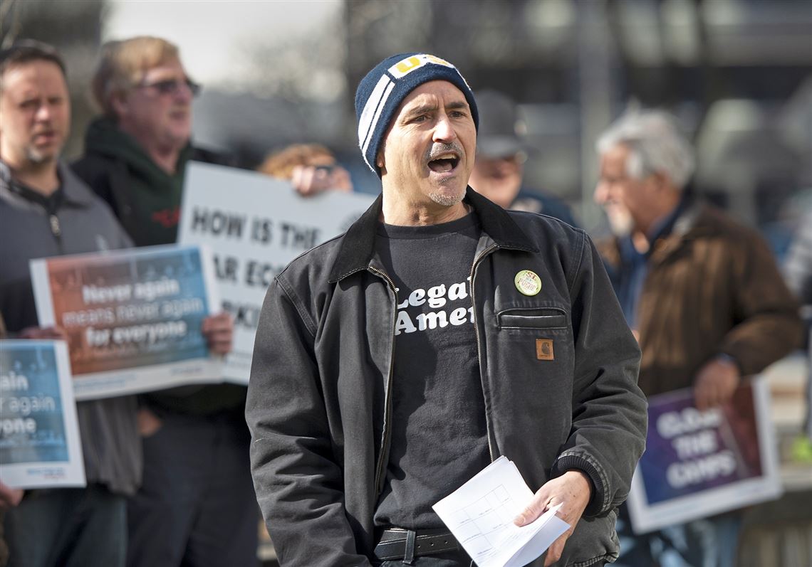 Guillermo Perez, president of the Pittsburgh Chapter of Labor Council for Latin American Advancement leads protestors in a chant during a rally to begin a public campaign calling on Pittsburgh's leading civic and environmental nonprofit organizations to refuse funding from the Colcom Foundation outside the foundation's office at Two Gateway Center downtown Thursday, Mar. 5, 2020 in Pittsburgh.  