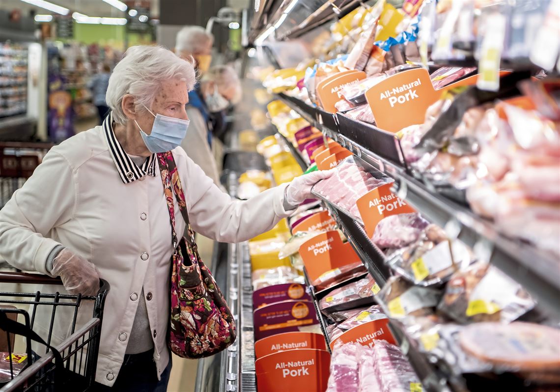 A woman, who declined to be identified, shops for meat at the Giant Eagle grocery store in Ross.