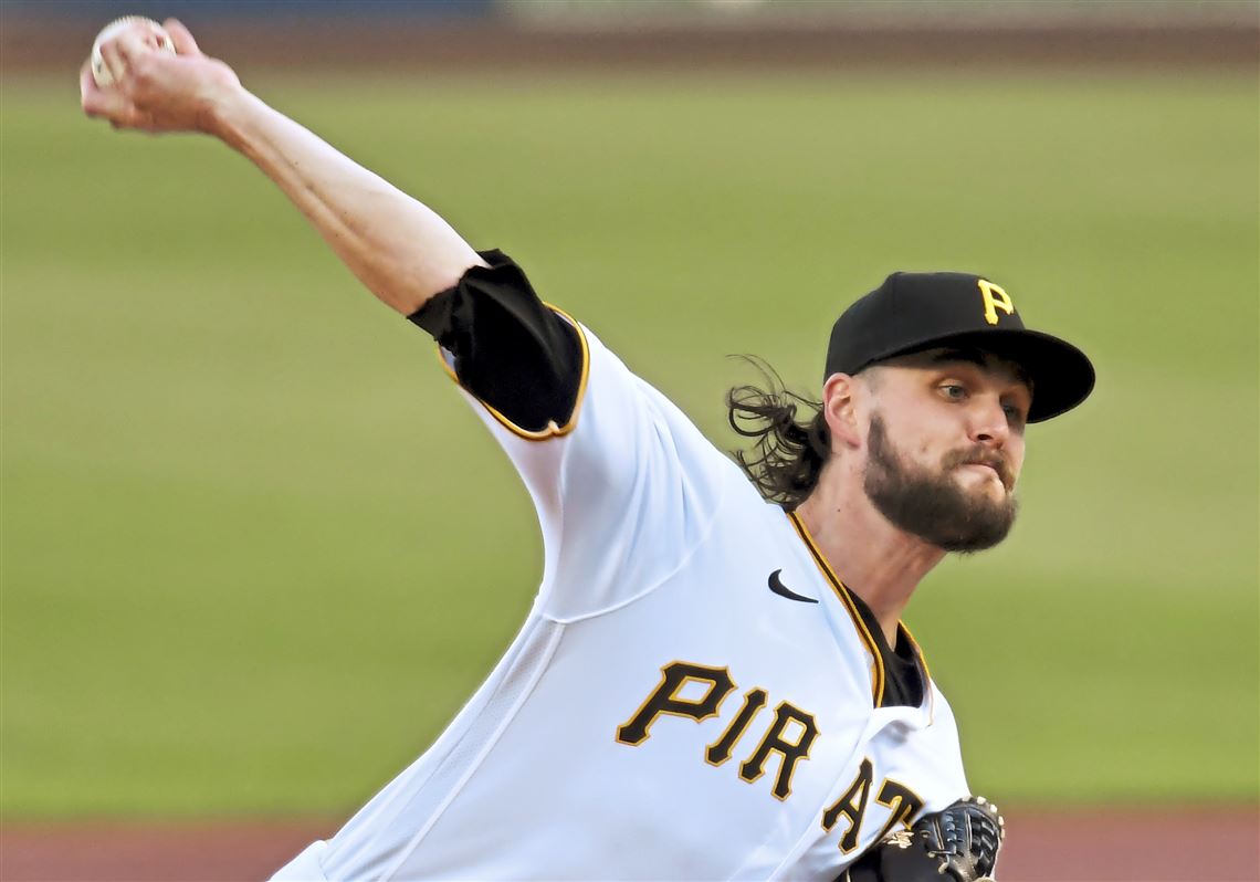 Pittsburgh Pirates starting pitcher JT Brubaker, left, tags out