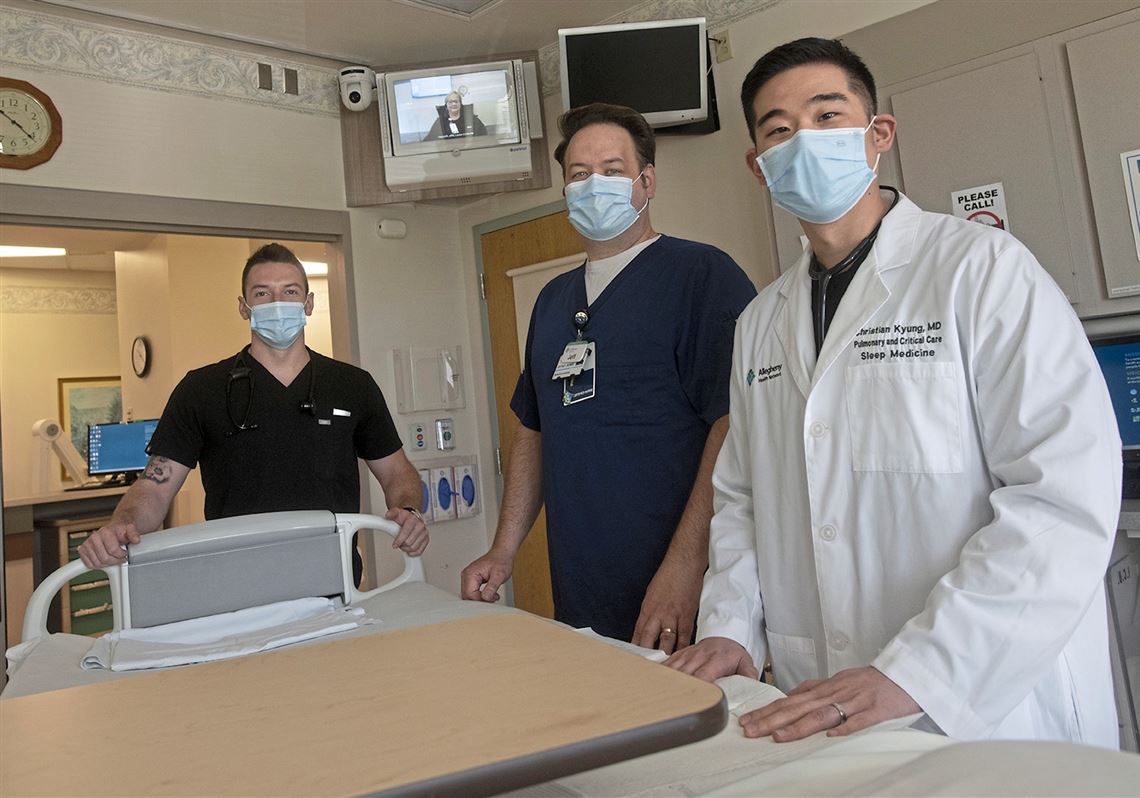 Physician assistant Jeffrey Bright, nursing manager Jeff Bomba and critical care doctor Christian Kyung in a critical care unit at Allegheny Health Network's Jefferson Hospital.