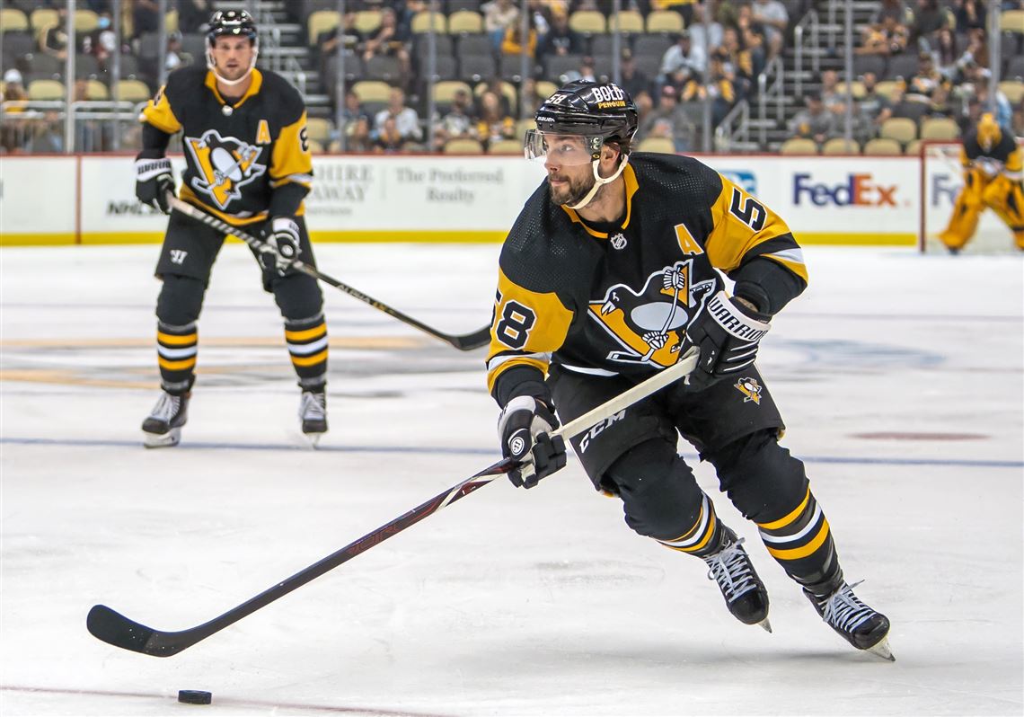 Kris Letang plays the puck with the stick behind his back : r/hockey