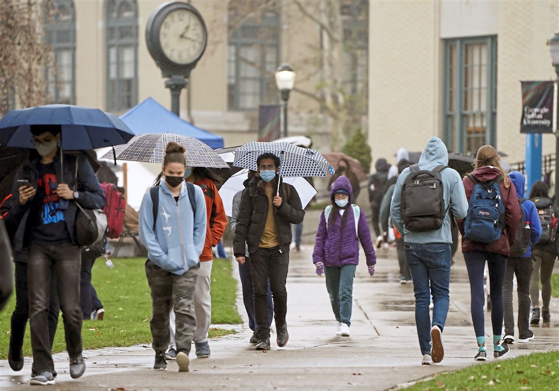 Students walk the campus of Carnegie Mellon University, Thursday, Nov. 18, 2021, in Pittsburgh. 