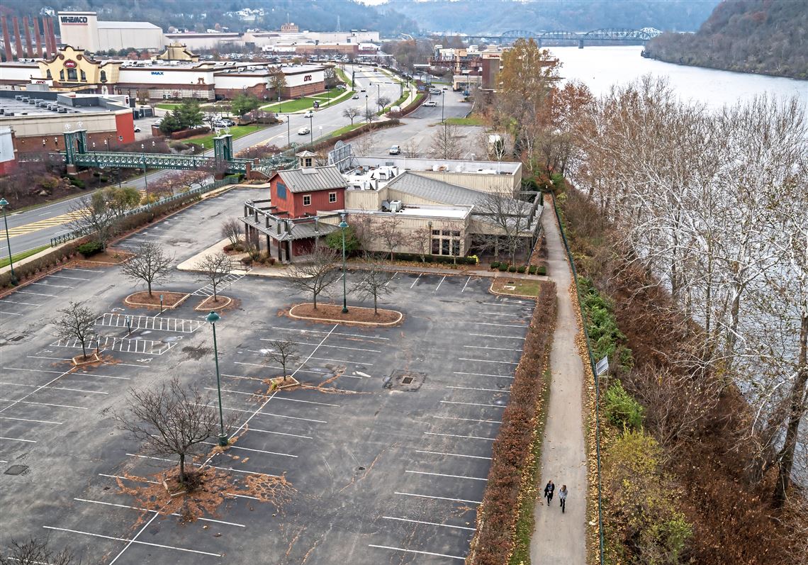 People walk along the Great Allegheny Passage trail where it passes by the Waterfront in Homestead, Sunday, Nov. 28, 2021