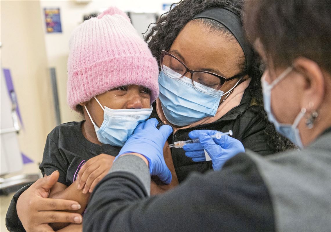 Parents at vaccine clinic hope for some normalcy as schools return