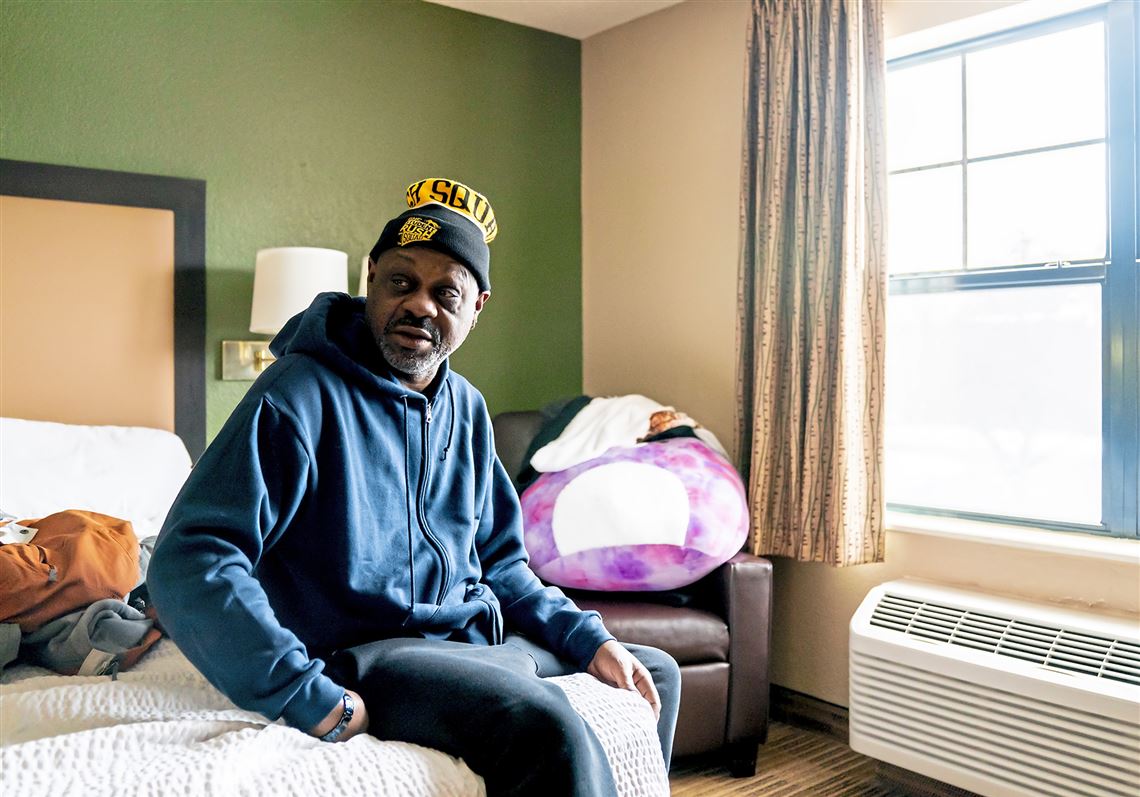 Joseph Averiett, a former resident of the Rodi Arms Apartments which was destroyed in a fire early Saturday morning, sits in his room in the Extended Stay America hotel in Monroeville, Tuesday, Jan. 25, 2022. Mr. Averiett and his family do not know where they will live after their hotel stay is no longer being covered by the Western Pennsylvania Search and Rescue Development Center.  (Alexandra Wimley/Post-Gazette)  Jesse Bunch reporting