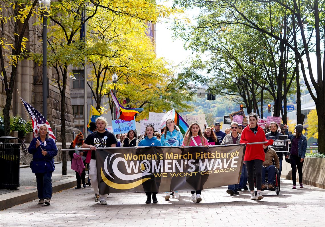 Women's rights marchers urge people to vote Nov. 8