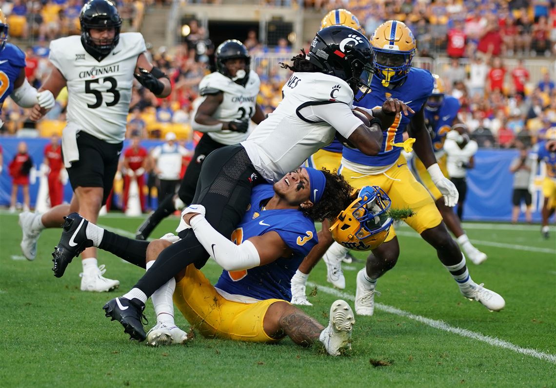 A fan halts play in the NFL season opener by sprinting onto the