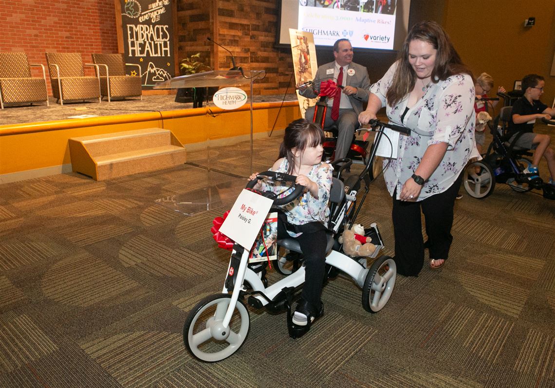 Children take a spin on adaptive bikes No. 3,000 and 3,001 provided by