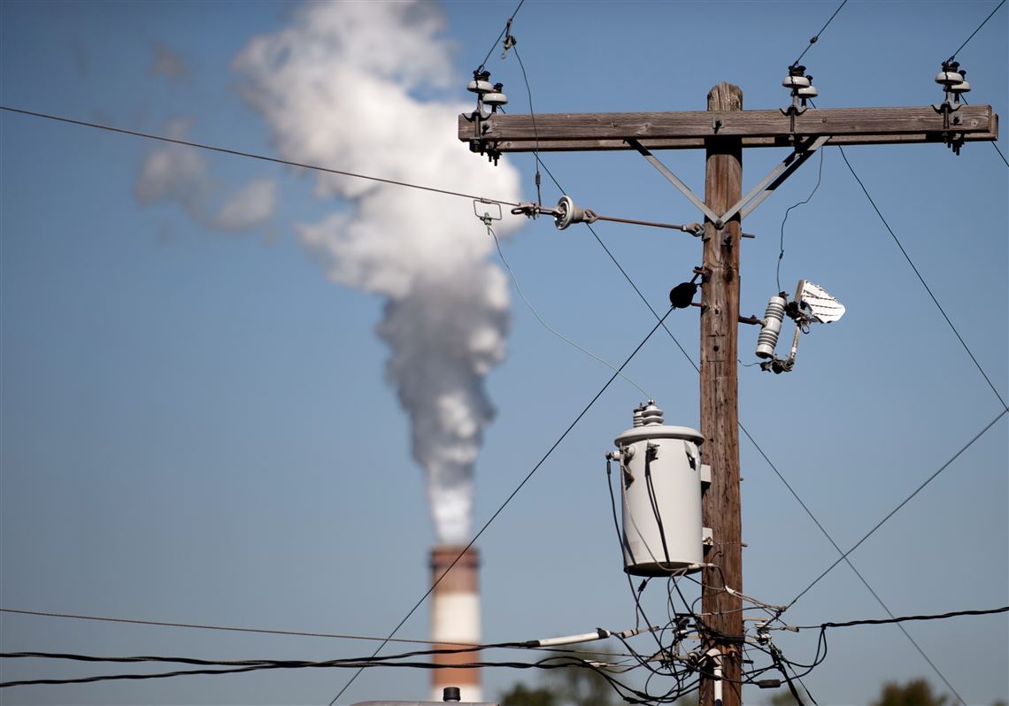 A plume of exhaust extends from the Mitchell Power Station, a coal-fired power plant in New Eagle, in September 2013. FirstEnergy Corp. closed the plant a month later, citing pressure from low natural gas prices and environmental regulations.
