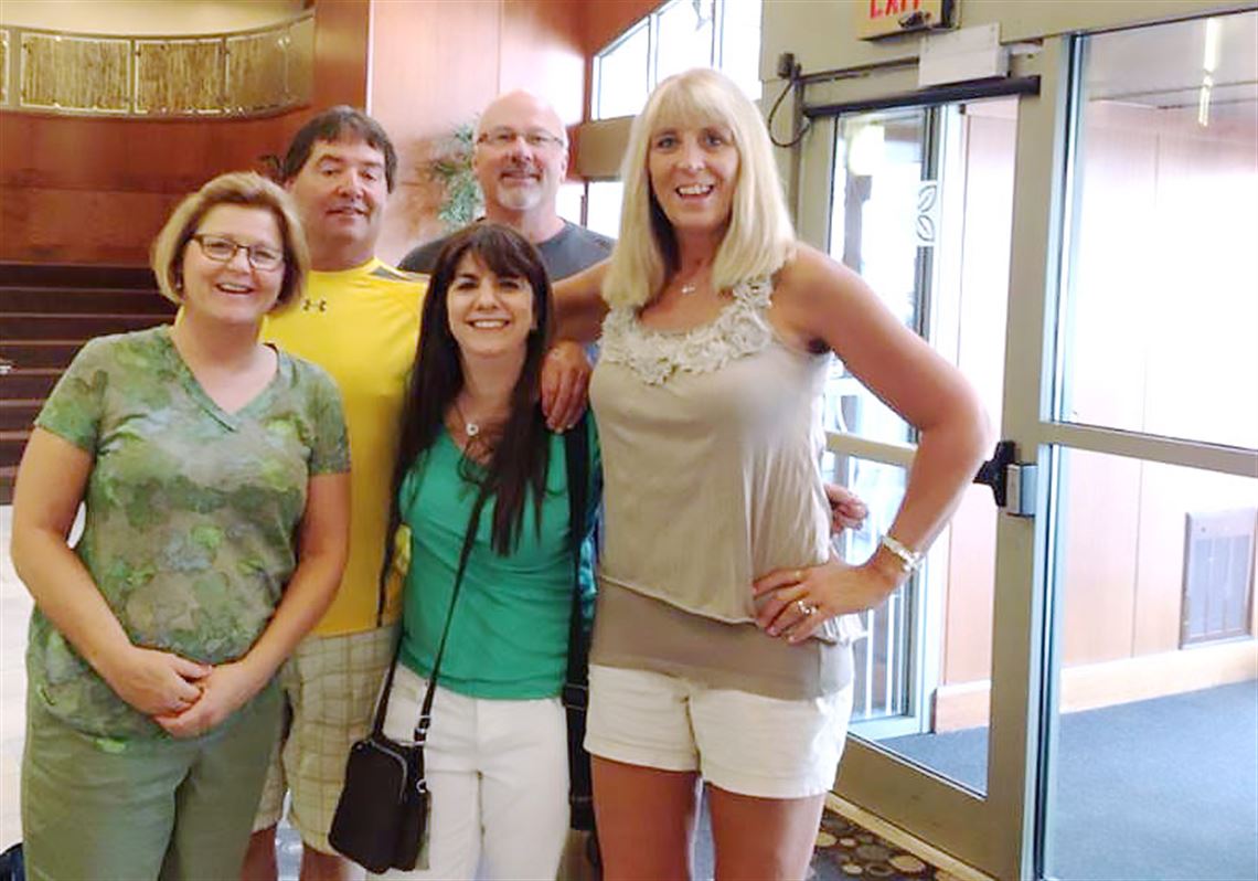 Author Niki Kapsambelis, center, is photographed at the Hilton Garden Inn in Oakland in 2013 with, l to r, siblings Karla (DeMoe) Hornstein and Dean DeMoe and their spouses Matt Hornstein and Deb DeMoe.  