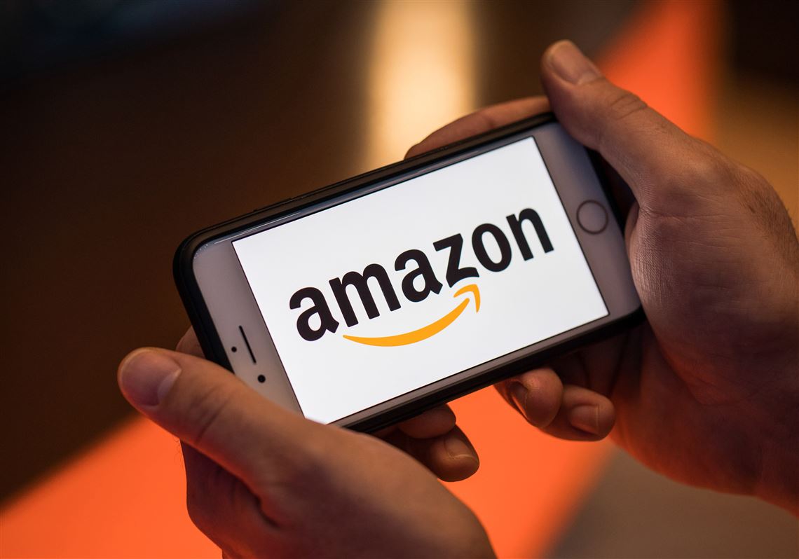 A person opens the Amazon app on their cell phone.