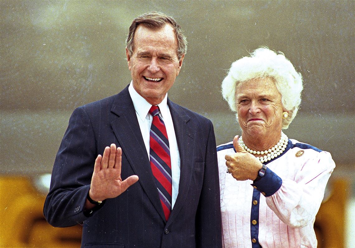 Vice President George Bush waves as his wife Barbara gives the thumb's up to photographers on their arrival in New Orleans, Aug. 15, 1988.  The vice president is expected to receive the Republican presidential nomination on Wednesday night at the Republican National Convention. 