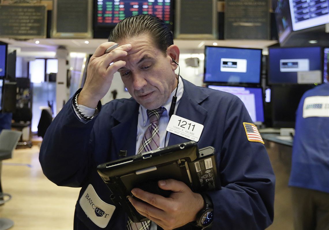 Trader Tommy Kalikas works on the floor of the New York Stock Exchange, Monday, July 24, 2017. Stocks are off to a mixed start on Wall Street as declines in health care and consumer-focused companies outweigh gains in other parts of the market. (AP Photo/Richard Drew)