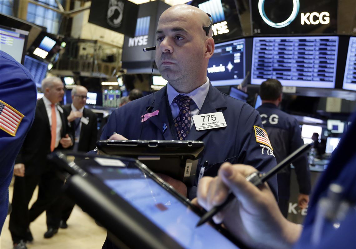 Trader Fred DeMarco works on the floor of the New York Stock Exchange, Wednesday, March 16, 2016. U.S. stocks are opening slightly lower despite a raft of generally positive economic reports as investors await the Federal Reserve's comments on the state of the economy later in the day. (AP Photo/Richard Drew)