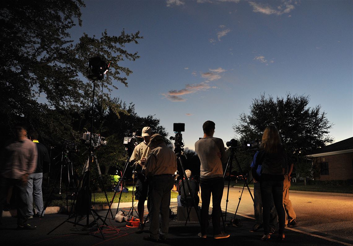 As the sun begins to set as television crews set up their lights while waiting for an update on the crew members aboard the missing cargo ship El Faro outside the Seafarer's International Union hall in Jacksonville, Fla., Sunday, Oct. 4, 2015. Authorities lost contact with the El Faro early Thursday as the ship sailed through the Bahamas at the height of the Hurricane Joaquin storm as it sailed from its homeport in Jacksonville, Fla., to San Juan, Puerto Rico. (Bruce Lipsky/The Florida Times-Union via AP) MANDATORY CREDIT