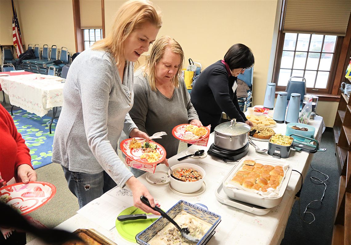 Rachel Fields, left, and her mother Susan Fields enjoy the spread at Shaler North Hills Library's  monthly "Food for Thought" gathering on Feb. 12.