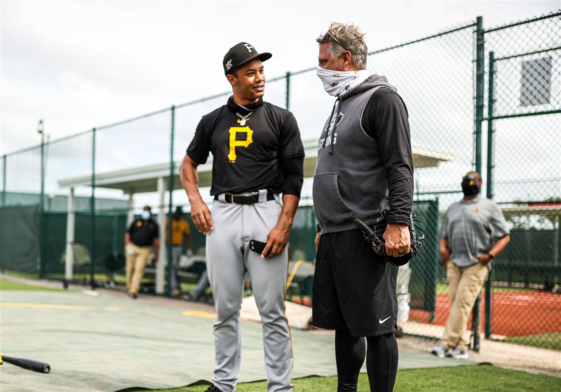 Pittsburgh Pirates' Cal Mitchell, right, is greeted by Jack
