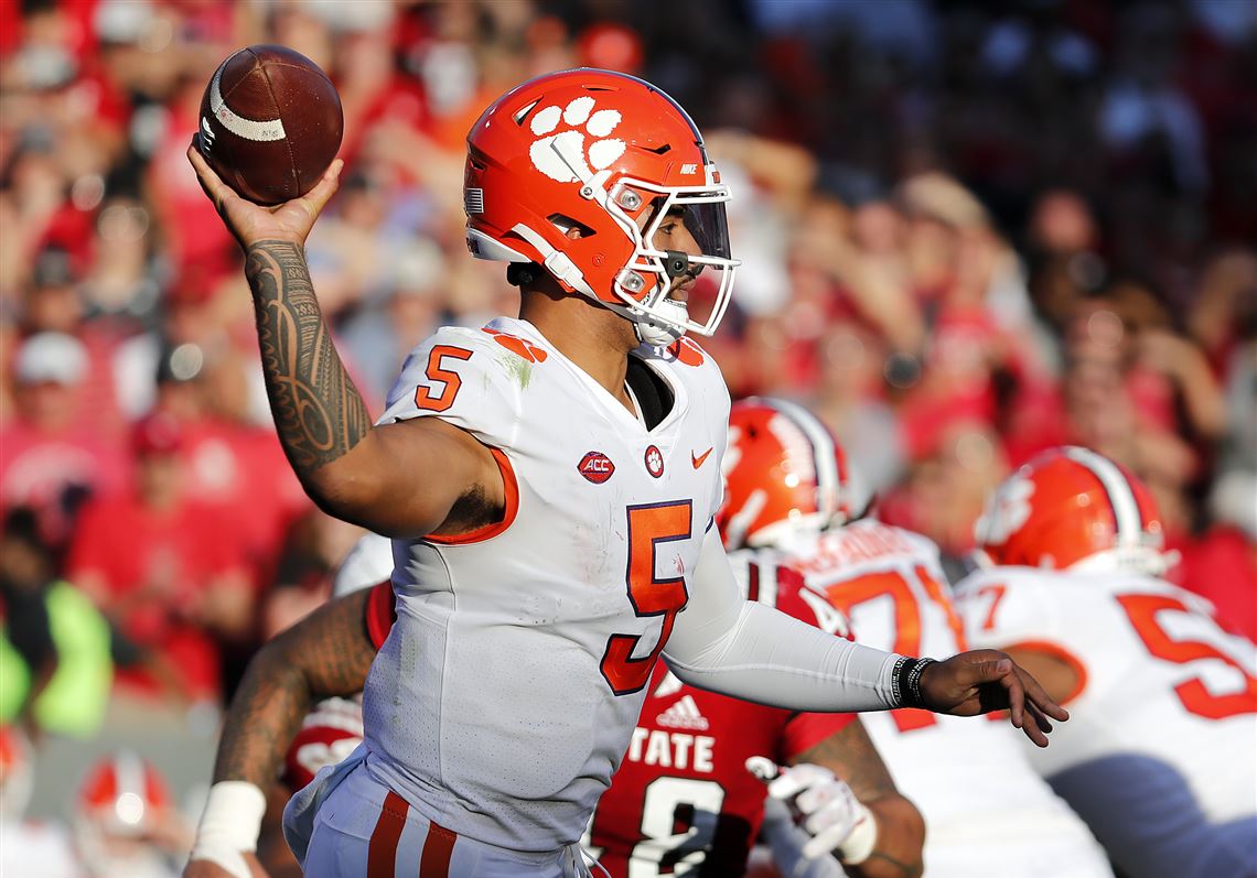 Clemson quarterback Trevor Lawrence hands the ball off to Travis Etienne  during the first half of an NCAA college football game against Duke  Saturday, Nov. 17, 2018, in Clemson, S.C. Clemson won