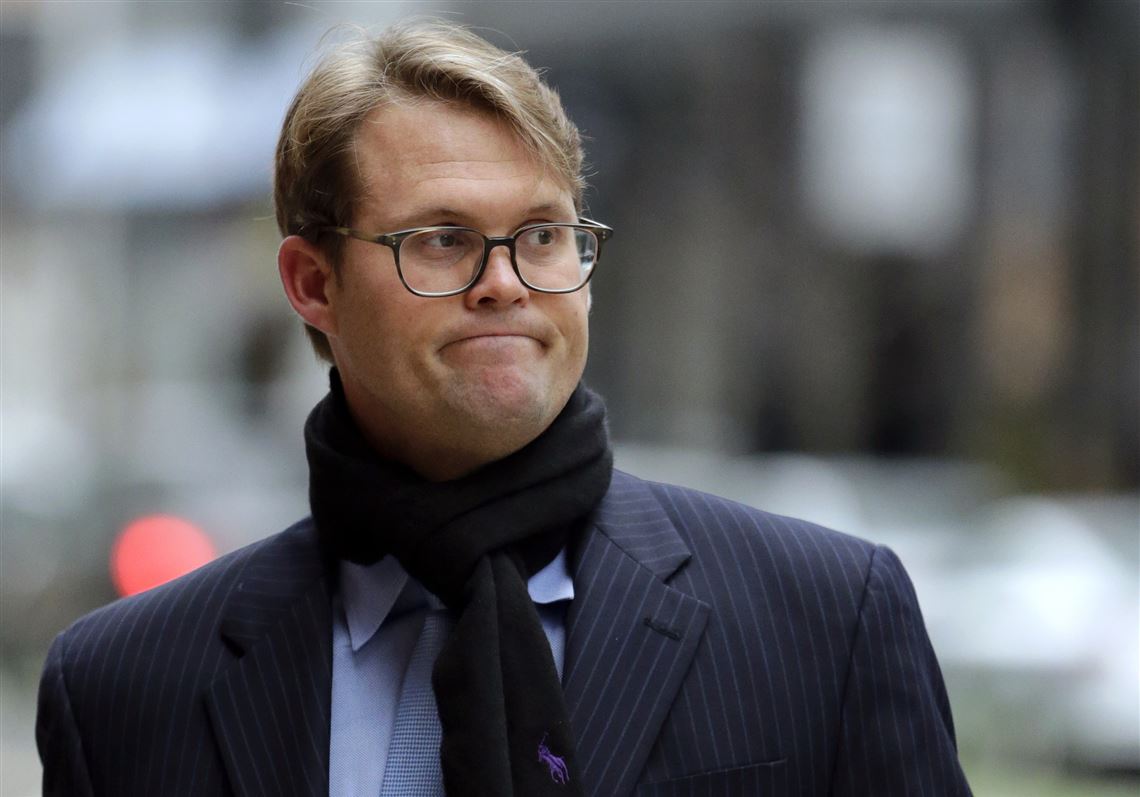Mark Riddell arrives at federal court Friday, April 12, 2019, in Boston, where he was scheduled to plead guilty to charges in a nationwide college admissions bribery scandal. Riddell, a former Florida prep school administrator, has pleaded guilty to rigging studentsâ€™ entrance exam scores in a nationwide college admissions cheating scheme. (AP Photo/Charles Krupa)